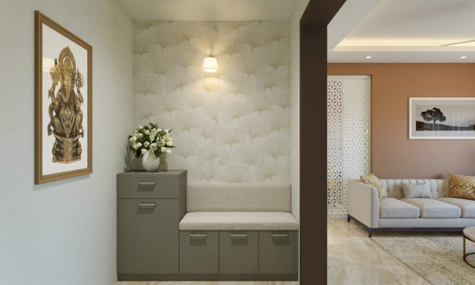 1bhk flat entryway is designed with floral patterned wallpaper and a foyer unit with a seater