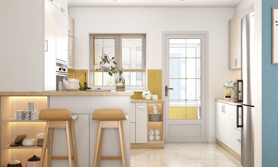 2bhk g shaped kitchen has a breakfast countertop and two tall wooden stools.