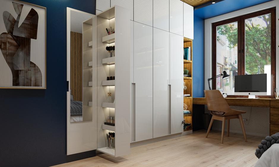 Hinged wardrobe door swings outward, providing full access in spacious, classic bedroom designs.