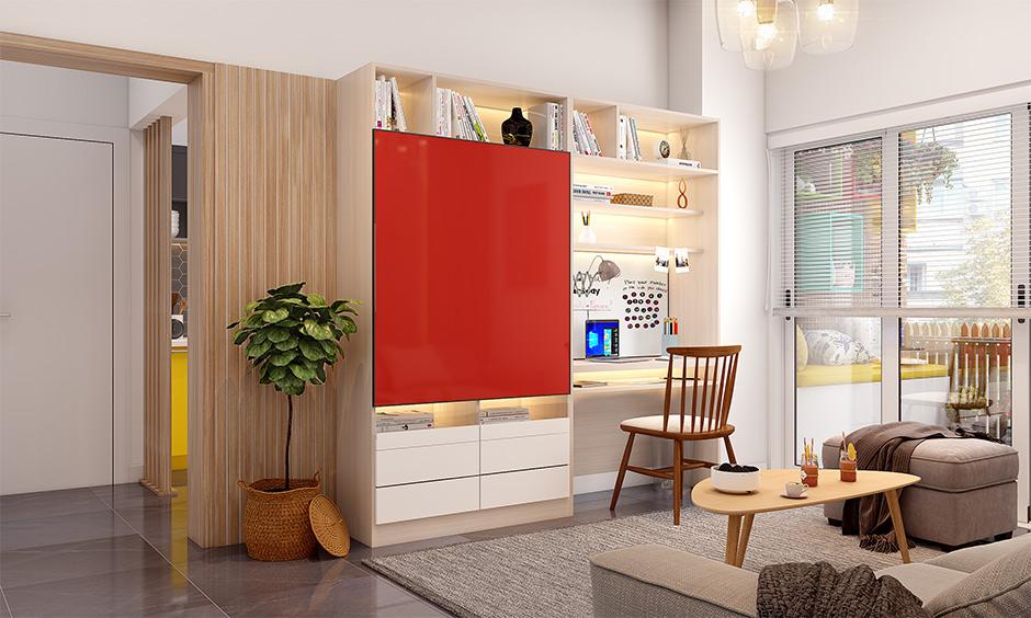 Contemporary home office with sliding TV unit hiding a compact workstation and shelves.