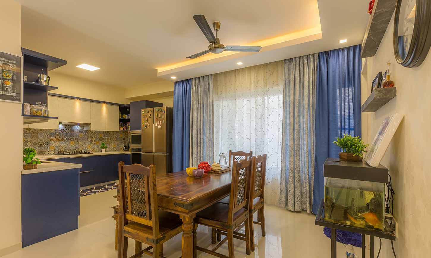 Dining room interior with living room designed by one of the top interior design firms in bangalore