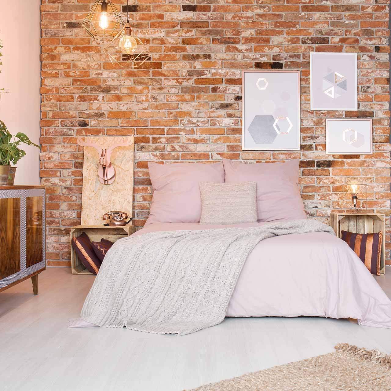 Warm industrial bedroom with hanging rope lights
