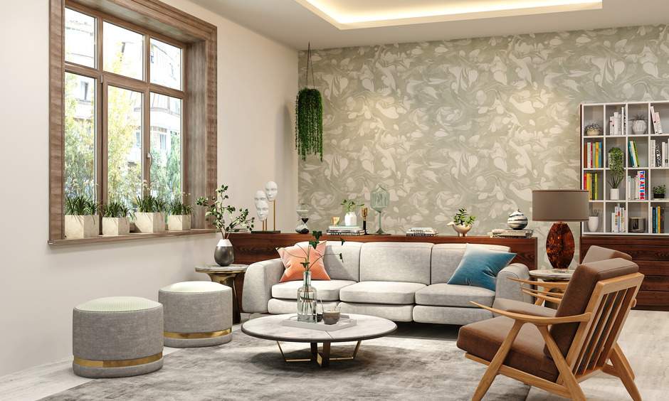 Vibrant living room with cosy seating and lush indoor plants – 2025 living room trends.