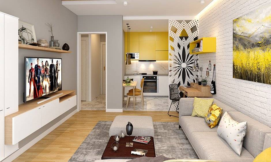 Choose an open layout for a rectangular living room and add a jaali partition between the living room and kitchen