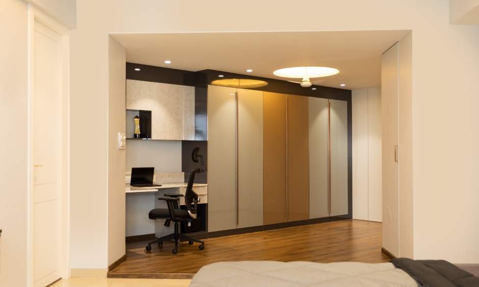 Stylish 3 BHK interior in Powai with a floor-to-ceiling wardrobe and compact home office.