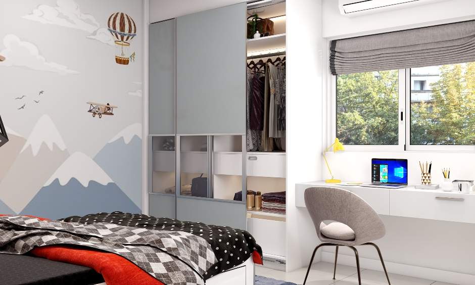 A sliding kids bedroom wardrobe with glass panels
