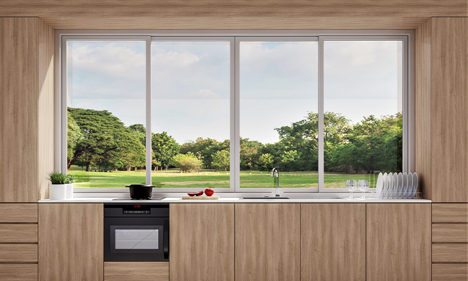 Sliding kitchen window with aluminium frames is a popular trend for affordable, low-maintenance home design.