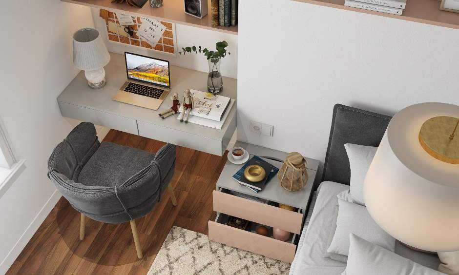 A small home office design in the bedroom comes with under cabinet lights that keep the desk illuminated