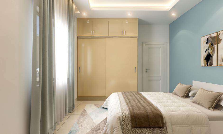 Modern bedroom with a sleek sliding door wardrobe design ideal for compact, stylish interiors.