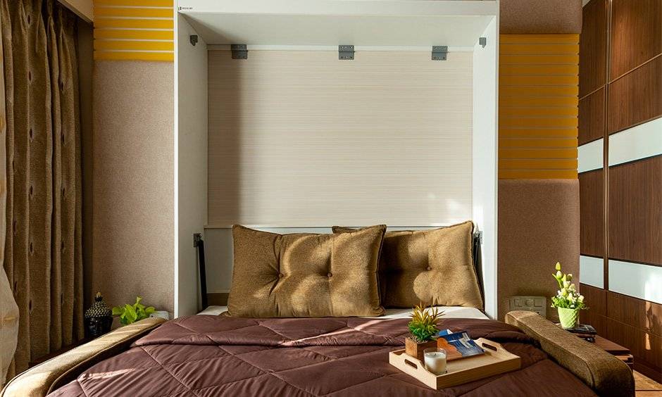 The third bedroom comes with a smart Murphy bed setup that can be pushed back into the wall designed by famous interior designers in mumbai