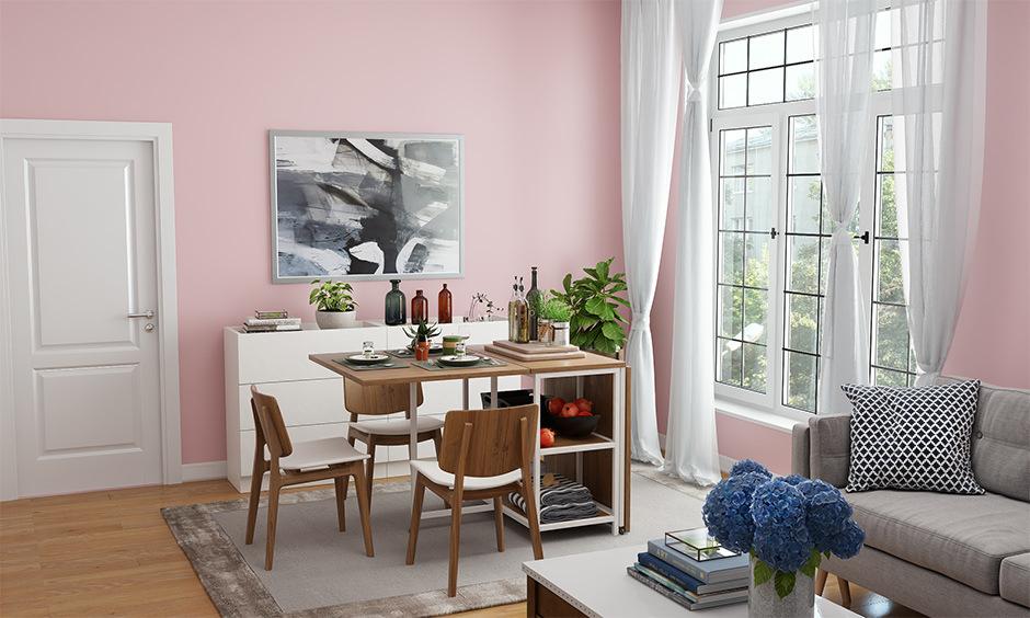Soft pink living space with pastel walls and cosy décor for a welcoming Vastu-compliant look