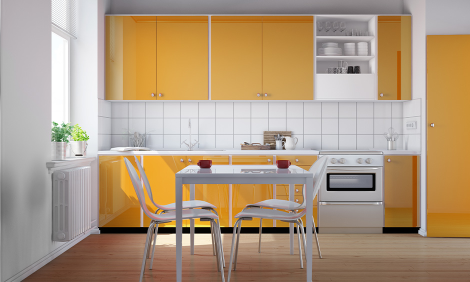 Pastel orange and white kitchen design reflecting warmth and Vastu’s fire element energy