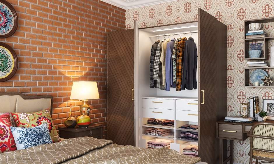 The wardrobe design in the bedroom has drawers, open shelves and dedicated space for hanging clothes